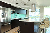 Brown kitchen with stone bench top